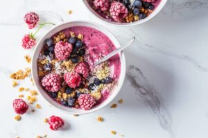 Greek yogurt topped with goji berries and honey.